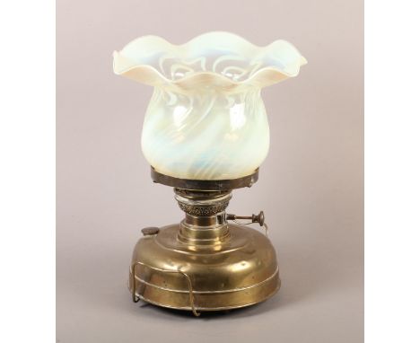 A VICTORIAN VERITAS LAMPE, oil heater/lamp having a large vaseline glass shade with wavy rim, brass burner and reservoir with