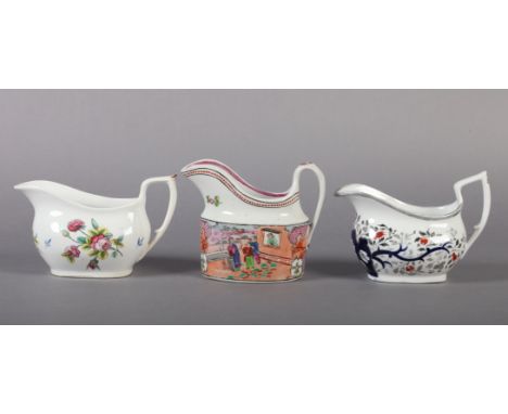 THREE NEWHALL PORCELAIN HELMET-SHAPED CREAM JUGS c.1810 pattern 977, painted in underglaze blue, iron red and silver lustre w