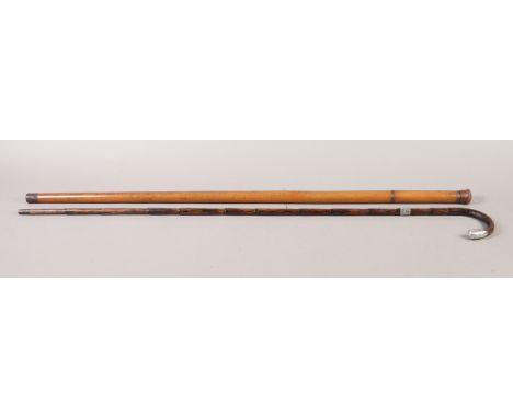 A 19TH CENTURY MALACCA WALKING CANE, in two screw off sections containing a small drinking glass and a glass flask with cork 