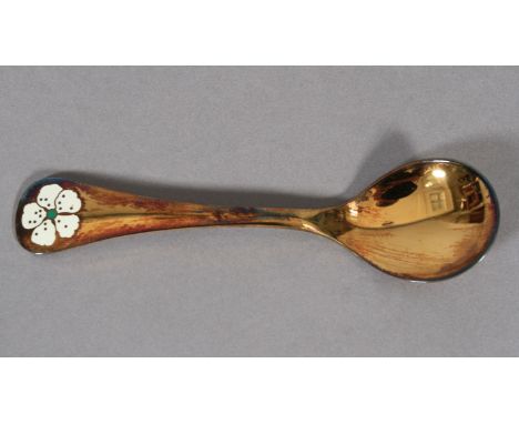 GEORG JENSEN, a  .925 silver gilt year spoon for 1971 with cherry blossom motif in white and green enamel, 15cm long 