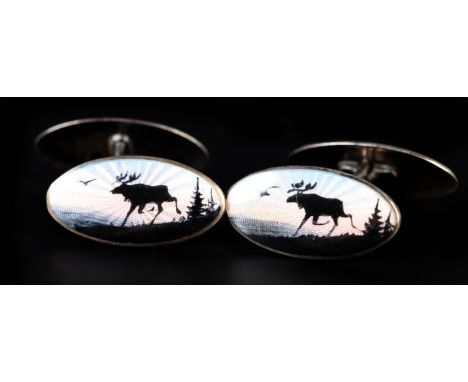 A PAIR OF NORWEGIAN SILVER AND ENAMEL CUFFLINKS BY AKSEL HOLMSEN each oval face with a polychrome guilloche scheme of a Europ