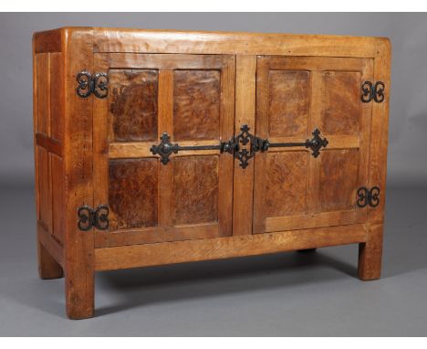 THOMPSON OF KILBURN MOUSEMAN ENGLISH OAK CUPBOARD, c.1926/1928 PRE-MOUSE, adzed, having two doors each of four indented burr 