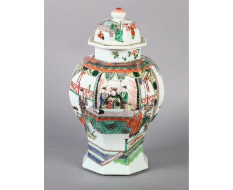 A CHINESE OCTAGONAL PANELLED BALUSTER VASE decorated with emperor, attendants and other figures within rooms and landscapes, 