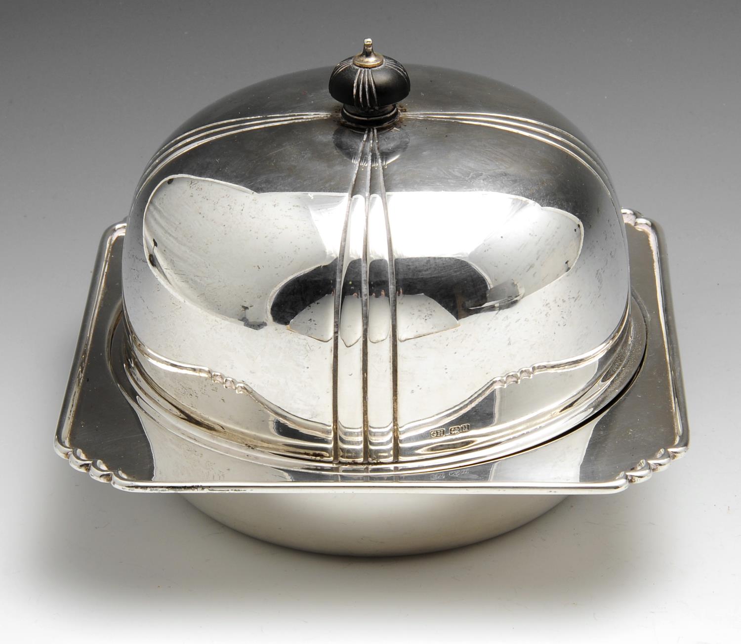 A 1930's silver muffin dish, the shaped square base dish having an