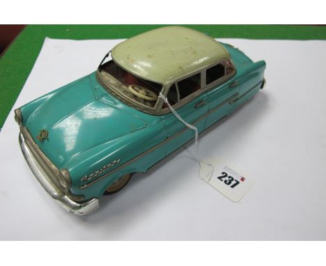 A Post War Tinplate Friction Drive Opel 'Kapitan', by Gama of West Germany, white/green finish, missing rear lights, windows,
