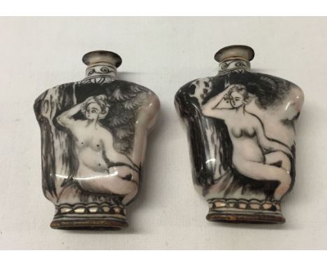 2 miniature enamel over copper snuff bottles with hand painted naked lady decoration. 5.5cm tall.
