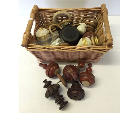 Basket of curtain pole ends to include vintage carved wood.