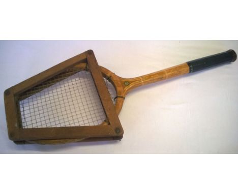 A vintage Spalding Bros wooden tennis raquet and frame.
