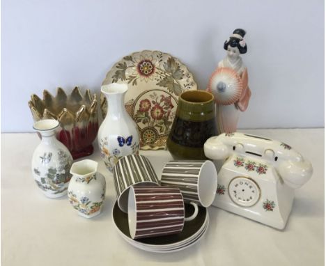 A collection of ceramics to include a Susie Cooper coffee cups & saucers, Aynsley, Wedgwood, Brixham Pottery and a Lladro sty