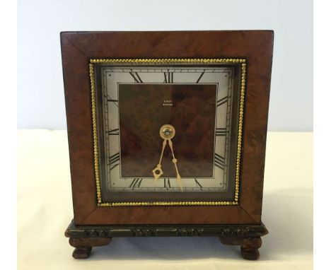 An Edwardian burr walnut small mantle clock with movement.