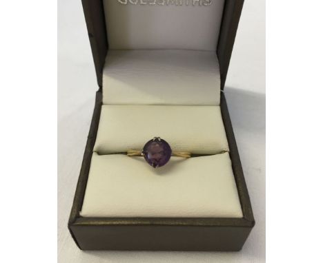 An 18ct gold ladies dress ring set with an amethyst. Size approx M½. Weight approx 2.3g.