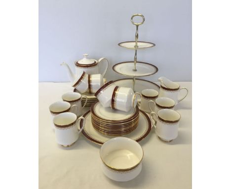 A Paragon red Holyrood tea service comprising teapot, sugar & milk jug, cake stand, sandwich plate, 10 cake plates, 7 saucers
