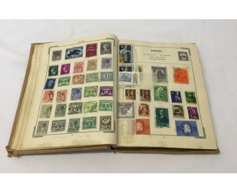 Vintage Stanley Gibbons stamp album containing British foreign stamps.