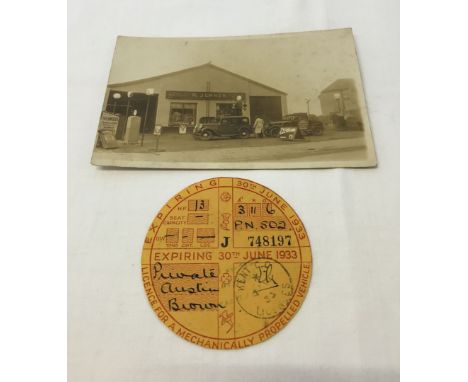 A vintage postcard of garage & vintage cars c1920-30s with a 1933 Austin tax disc.