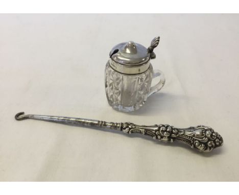 A silver topped crystal mustard pot in the shape of a lidded tankard (Chester 1933) together with a silver handled button hoo