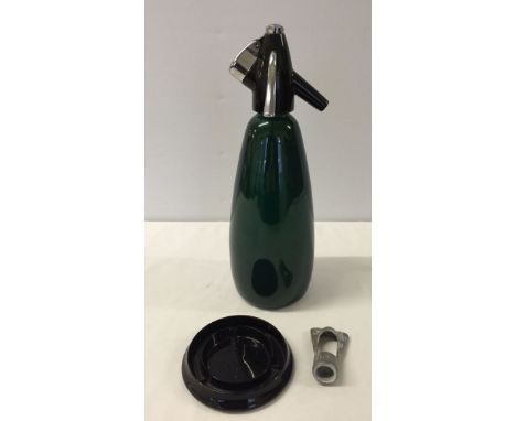 A vintage 1960s BOC Soda Syphon with key and saucer.
