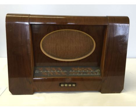 A large vintage HMV radio.