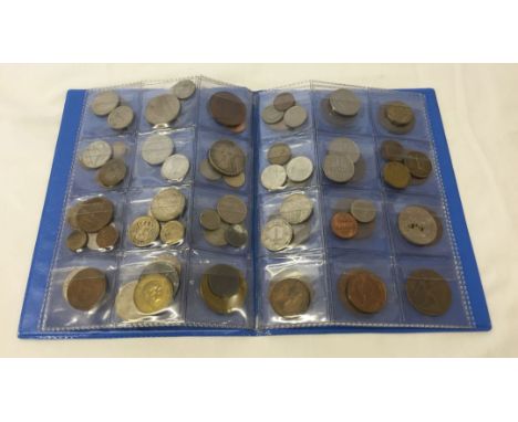 An album of vintage British and foreign coins including antique pennies.