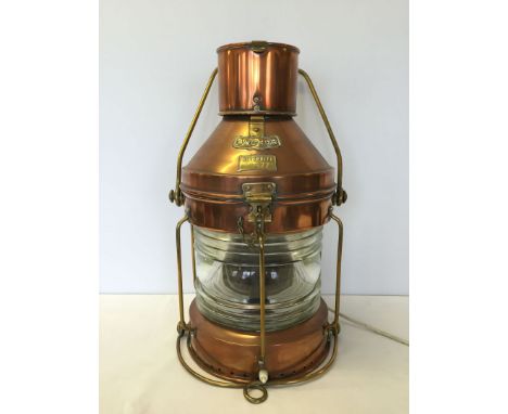 An original antique copper ships lantern with brass fittings & plaques 'Anchor' & 'Meteorite 105 773'. Measures 52cm tall, co