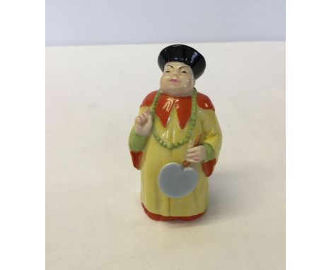 A Royal Worcester c1920s Mandarin Chinese man candle snuffer.