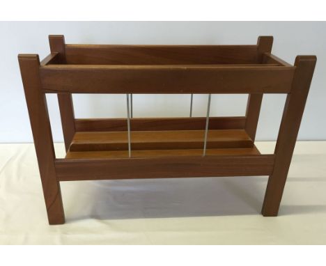 A light wood magazine rack c1970s.
