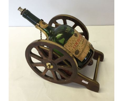 A brandy decanter in the form of a gun carriage.