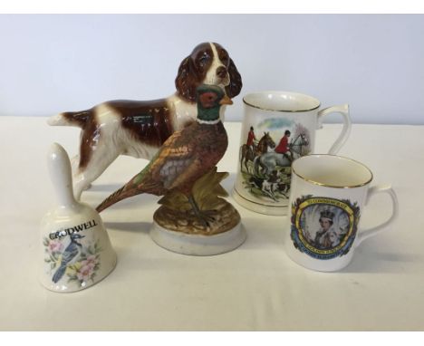 A Coopercraft spaniel, a china pheasant, a hunting mug, a bird bell and a commemorative mug.