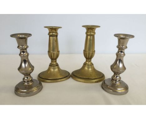 A pair of vintage brass candlesticks with a pair of plate candlesticks.