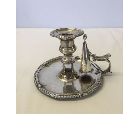 A silver plated candlestick & snuffer.