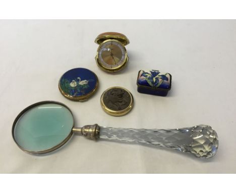 5 items to include a glass handled magnifying glass, a metamec travel clock and a ladies compact.