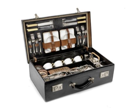 A cased picnic set for four persons by Drew &amp; Sons, 1920s,the textured black leather-cloth case with handle, nickelled lo