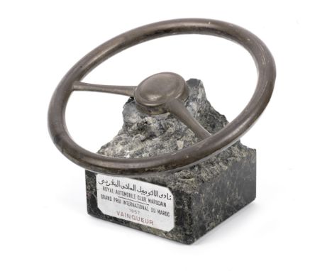 The 1957 Moroccan Grand Prix winner's trophy, awarded to Jean Behra for victory in a Maserati 250F,in the form of a simple ho