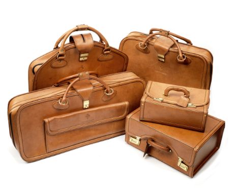A five-piece set of leather luggage for Ferrari Testarossa by Schedoni, Italian,each in brown leather and impressed with Pran