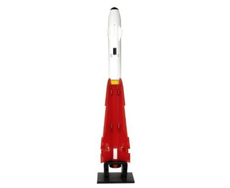 A Hughes Aim 4 Falcon guided air-to air missile,inert and disarmed, the shell re-painted in white and red, with yellow and bl