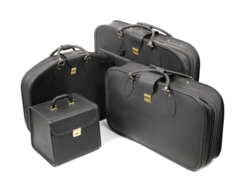 A four piece set of leather luggage for Ferrari 456 GT by Schedoni of Italy,in black leather with handles, locks and clasps, 