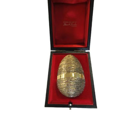 Stuart Devlin, London silver gilt egg opening to reveal two enamelled butterflies on flowers, in original box