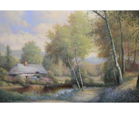 Paul R. Morgan, oil on canvas board, thatched cottage before a pond in a landscape, signed, 40 x 60cm, in a swept gilt frame