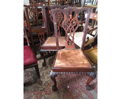 Set of four early 20th Century mahogany dining chairs in Chippendale style, the pierced splat backs above drop-in seats and c