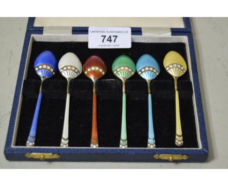 Cased set of six coloured enamel and silver coffee spoonsDo have light scratching and some chips to edges of enamel (more not