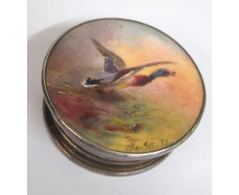 James Stinton for Royal Worcester, circular porcelain plaque inset into a silver rouge pot, painted with a mallard taking fli