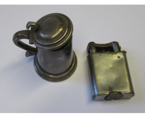 Dunhill silver plated lighter in the form of a tankard, and another plated Dunhill table lighter