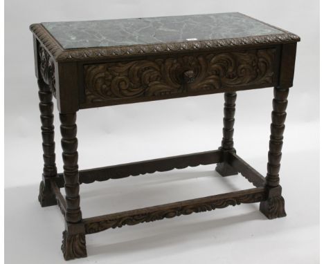 Late 19th / early 20th Century Continental oak serving table with a marble inset top above a carved drawer, bobbin turned sup