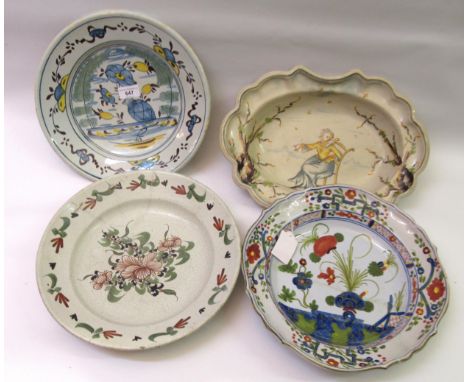 Four various antique Continental Delftware and majolica dishes, the largest 37cm wide