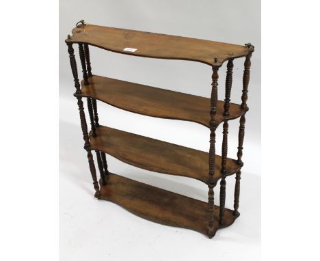 19th Century mahogany four shelf wall bracket with spindle turned uprights, 64cm wide, together with an Arts and Crafts eboni