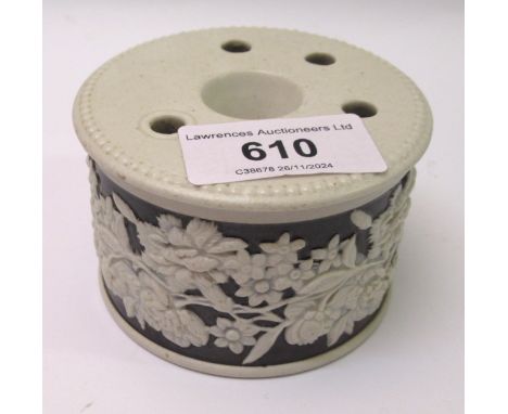 19th Century circular salt glazed inkwell relief moulded with floral decoration, 8cm diameter