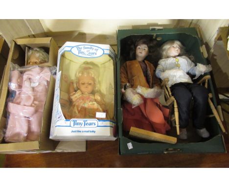 Tiny Tears doll in original box, Zapf doll in original box and two other modern bisque headed dolls, one seated in a Windsor 