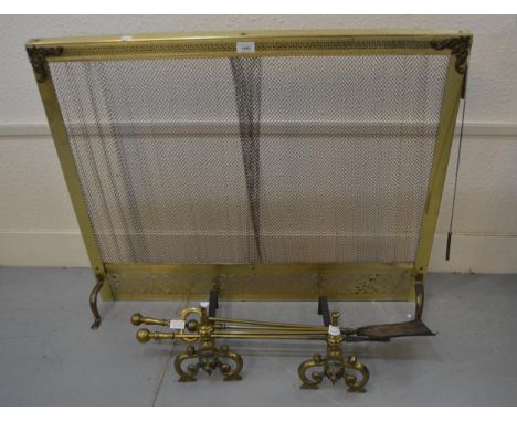 Mid 20th Century brass firescreen with retractable curtain, pair of brass fire dogs and a set of three fire irons