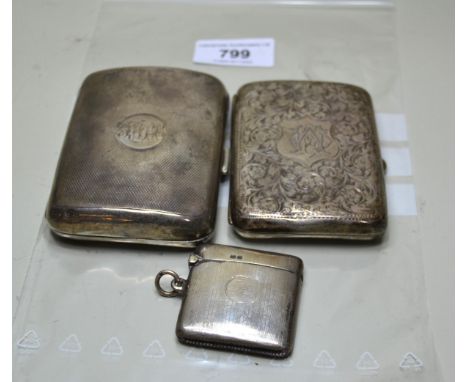 Two silver cigarette cases and a silver vesta case, 5.5oz t