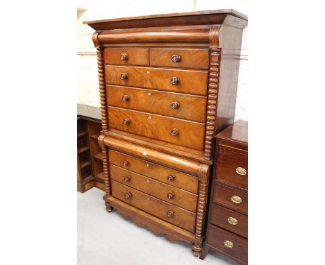 19th Century Scottish mahogany chest on chest, the moulded cornice above two short and six long drawers flanked by bobbin tur