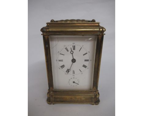 19th Century gilt brass carriage clock, the gorge case with white enamel dial, having subsidiary seconds and two train moveme